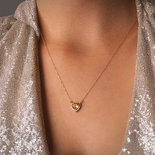 Heart-shaped citrine necklace: 18 kt yellow gold
