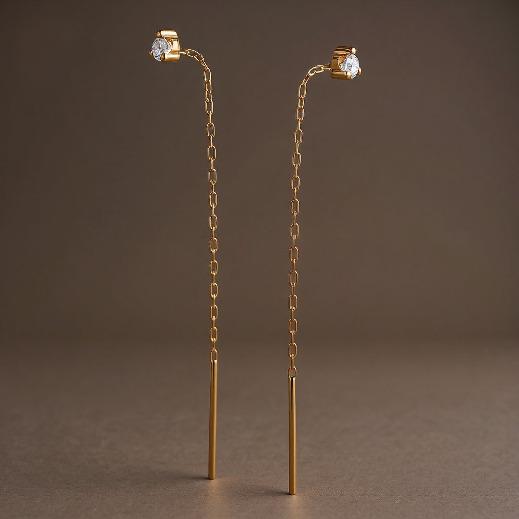 Threader long earrings: 18 kt yellow gold with zirconias
