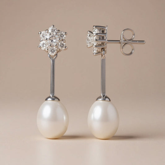 Petal flower pearl earrings: 9 kt white gold