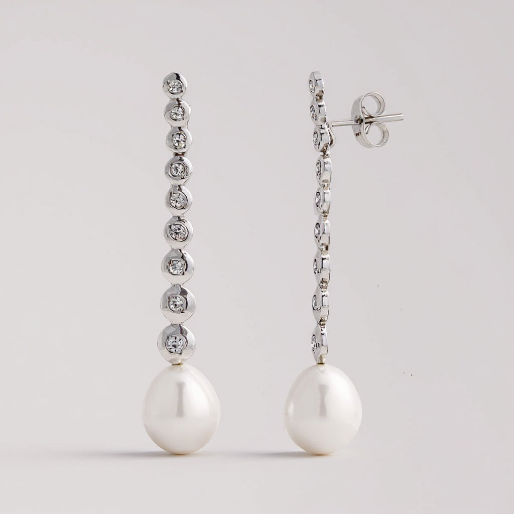 Line pearl earrings: 18 kt white gold with zirconias